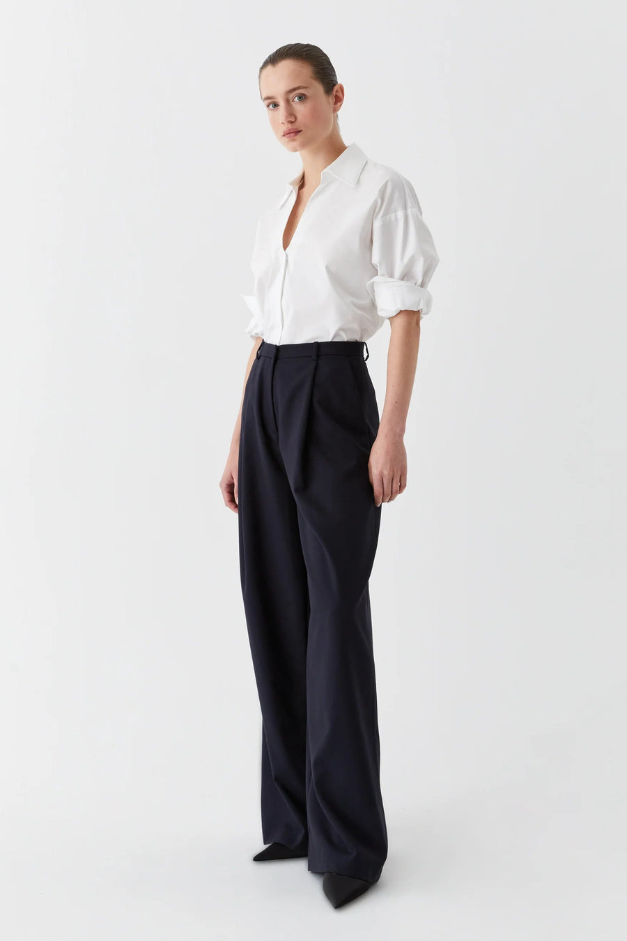 White cotton collared shirt with v neck and back yolk. 