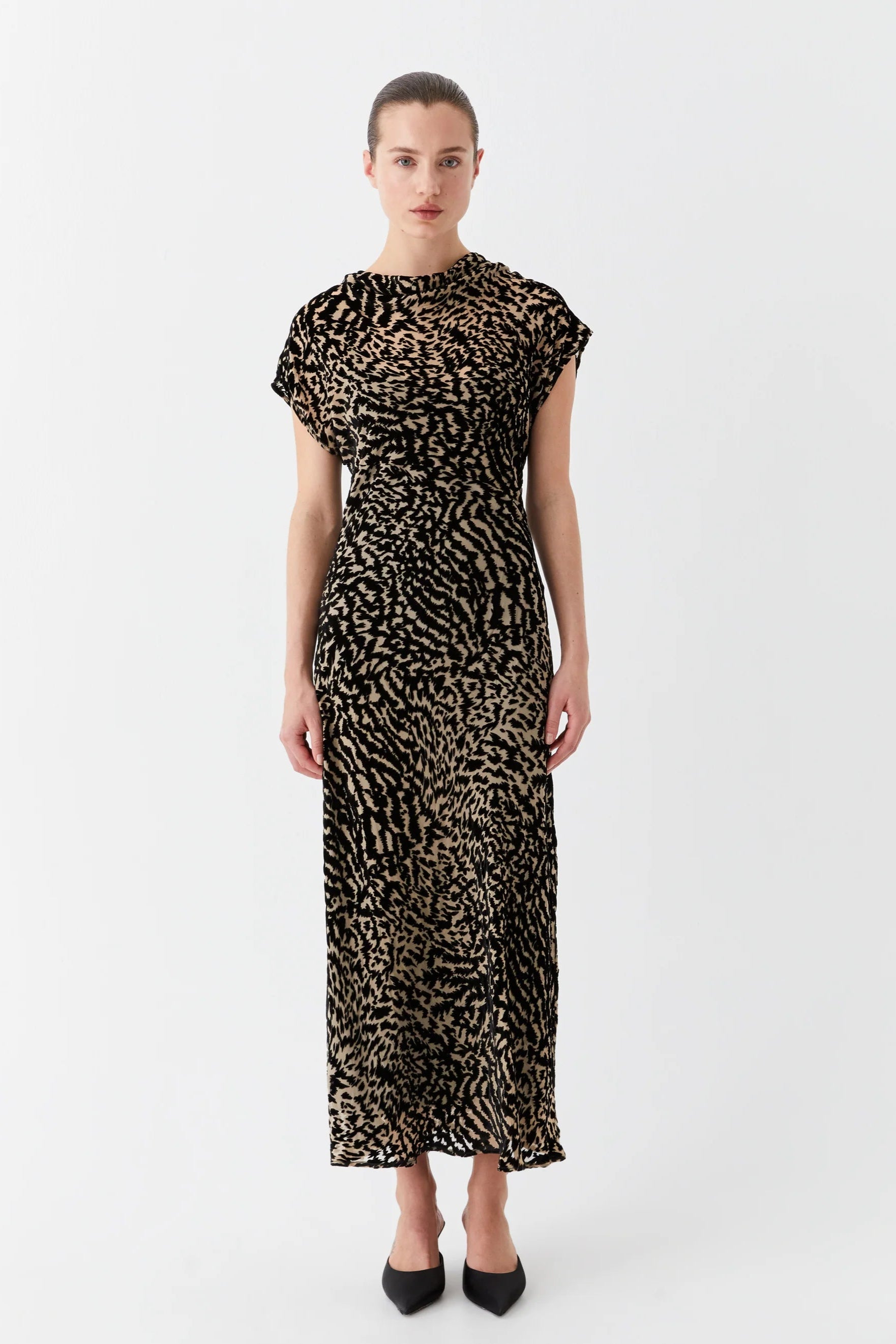 Bias cut dress with cowl neckline cap sleeve and black and tan print. 