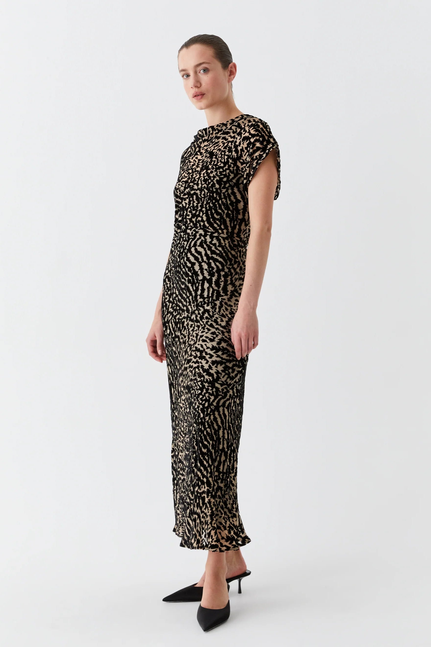 Bias cut dress with cowl neckline cap sleeve and black and tan print. 