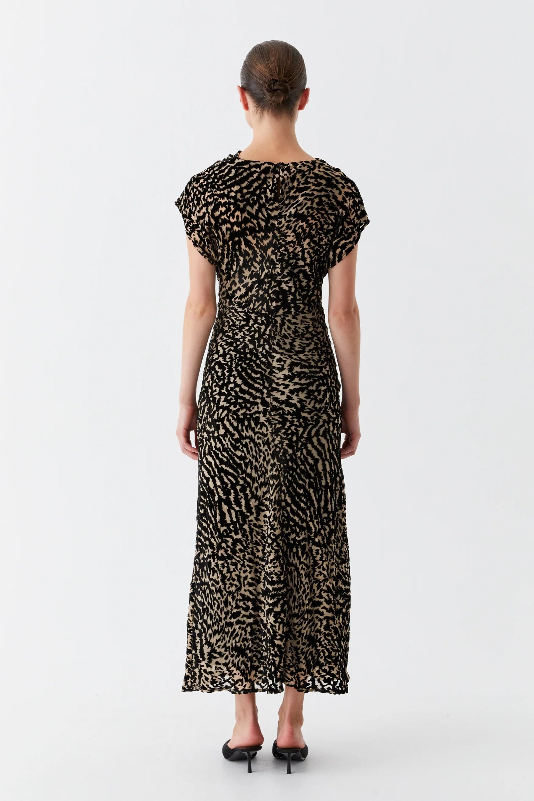 Bias cut dress with cowl neckline cap sleeve and black and tan print. 