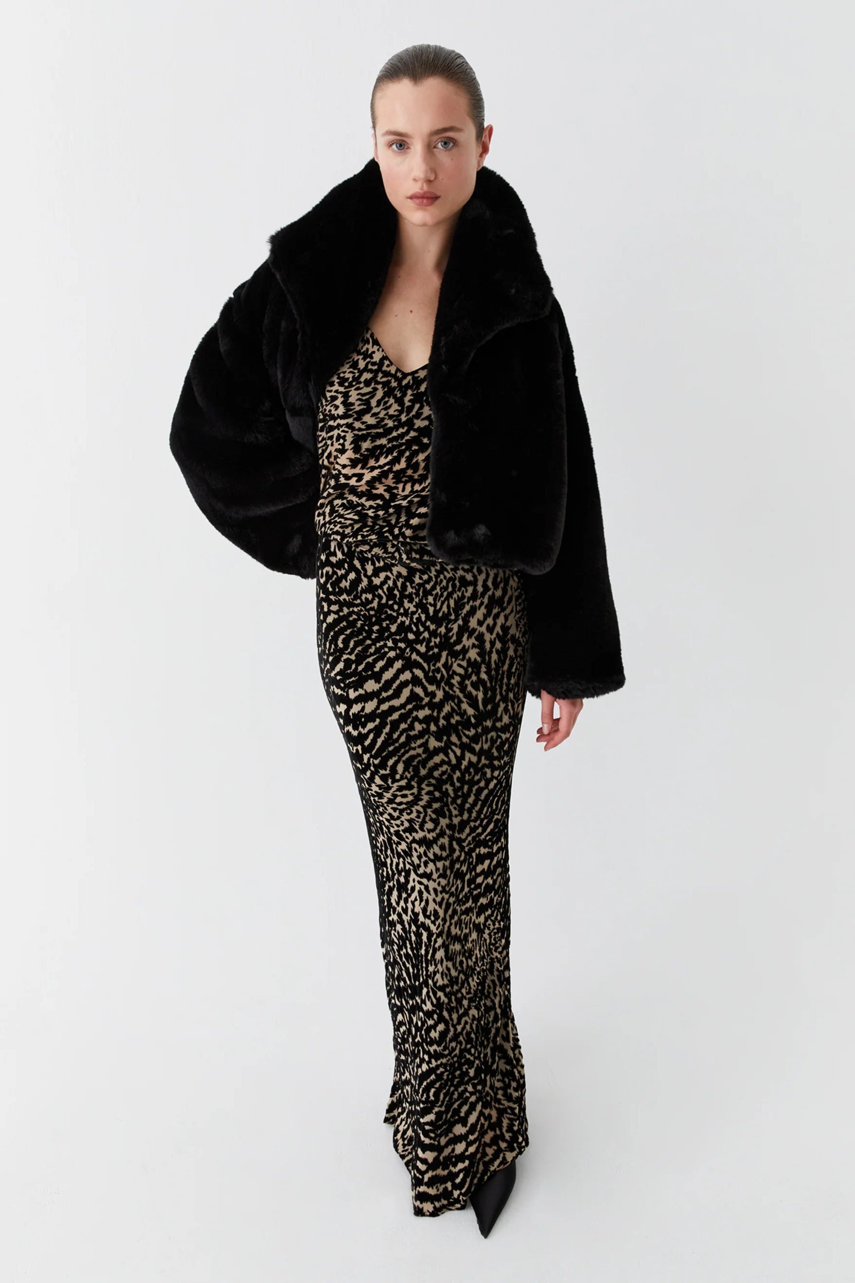 Bias cut dress with cowl neckline cap sleeve and black and tan print. 
