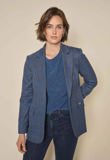Elegant checkered blazer, tailored in a relaxed, elongated silhouette. Blue Base with black and tan plaid.  
