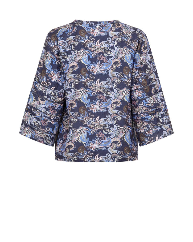A 3/4 sleeve Paisley blue print blouse shown from the back on a white background. 