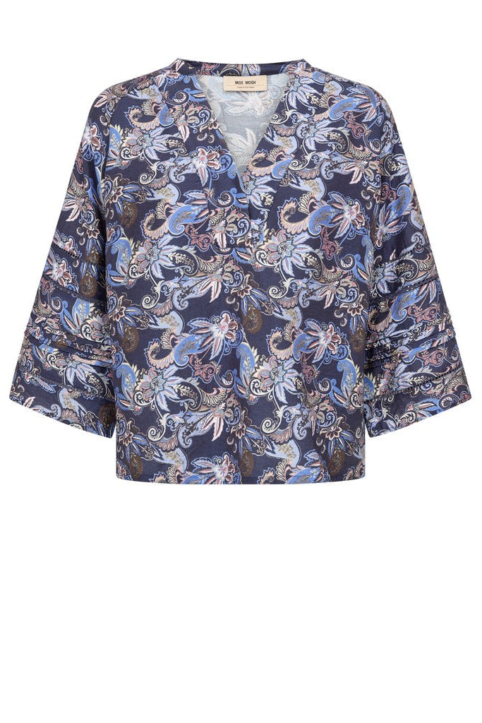 A 3/4 sleeve v neck Paisley blue print blouse shown from the back on a white background. 