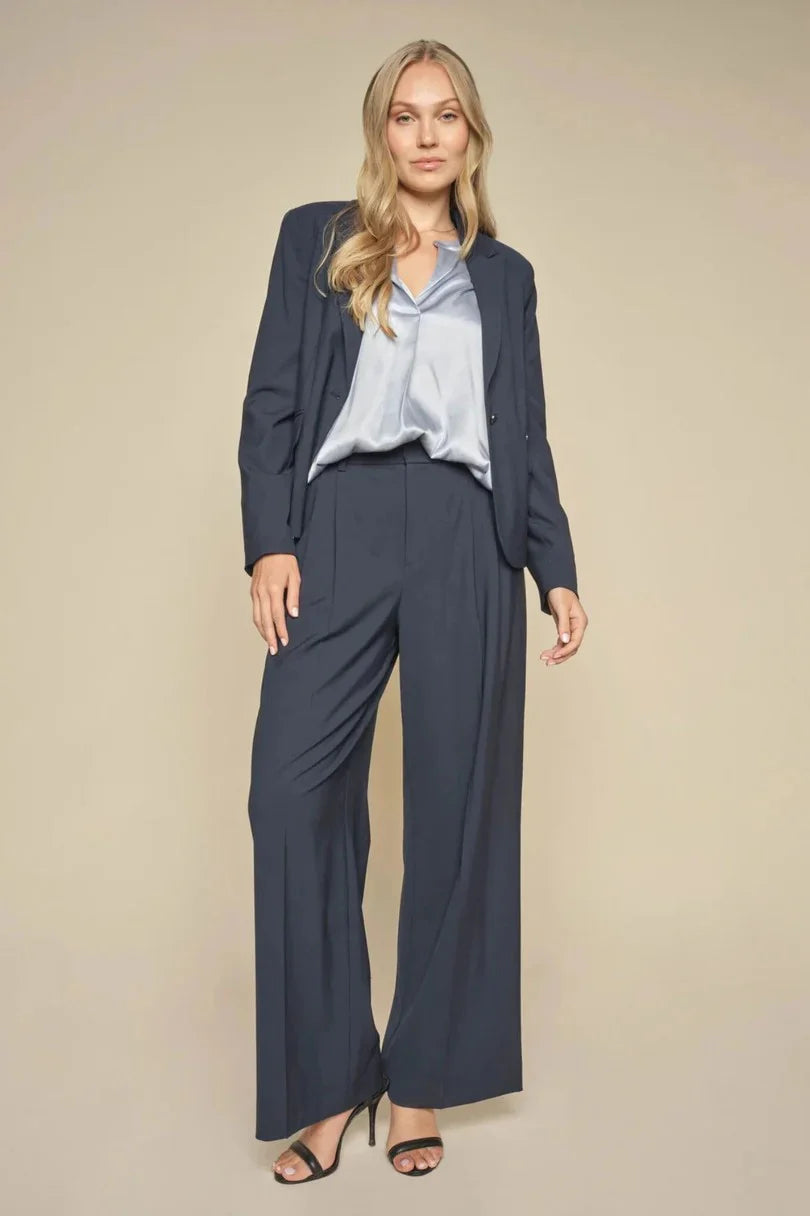 Navy Blazer with Zip detail above piped pockets. 