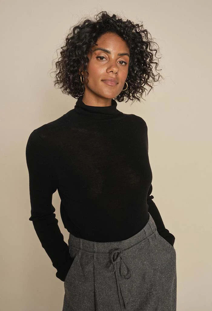 Black fine wool long sleeve knit with roll neck.  