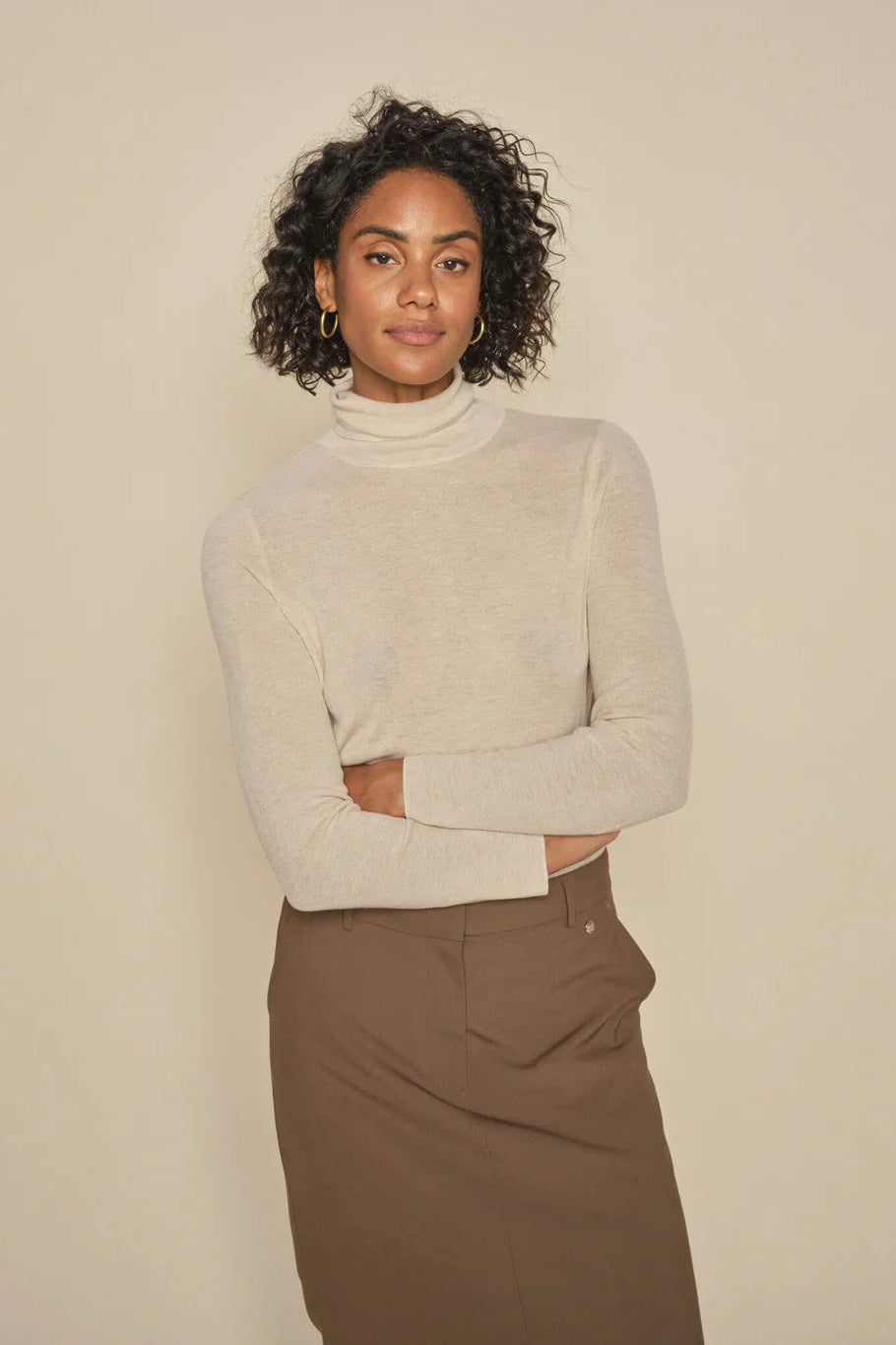 Beige Fine Wool Long sleeve Knit with Roll Neck. 