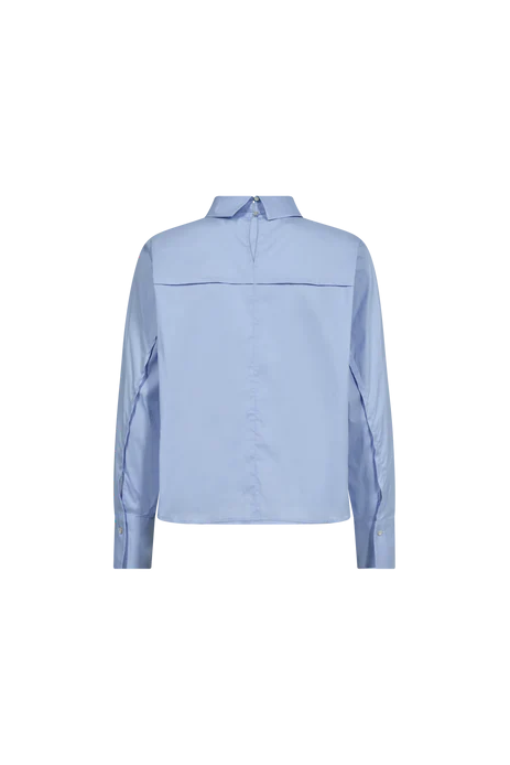 Light blue shirt with stand up collar and cut out opening at the back on a white background