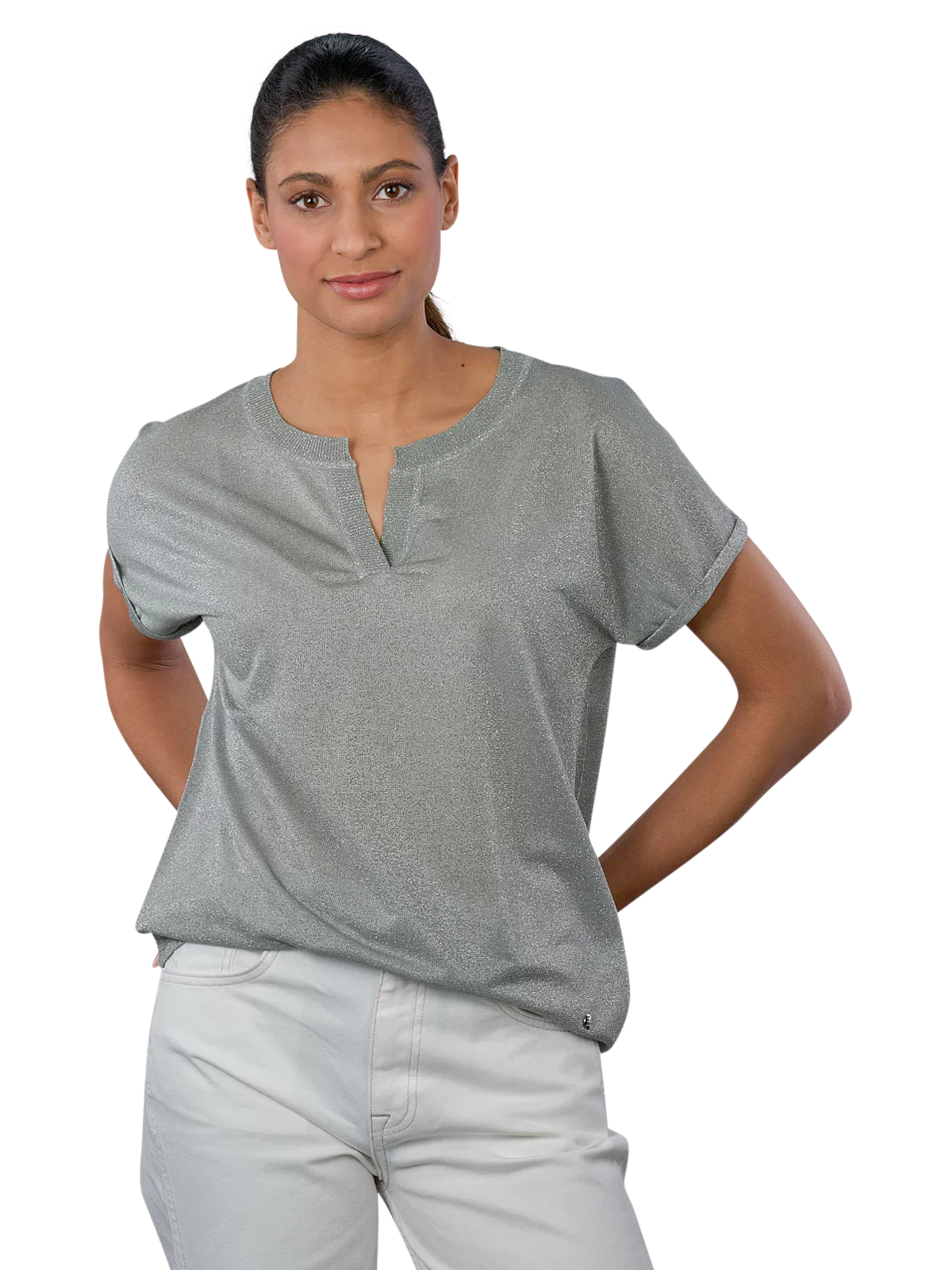 Woman wearing a gray short-sleeve top and light gray pants on a white background