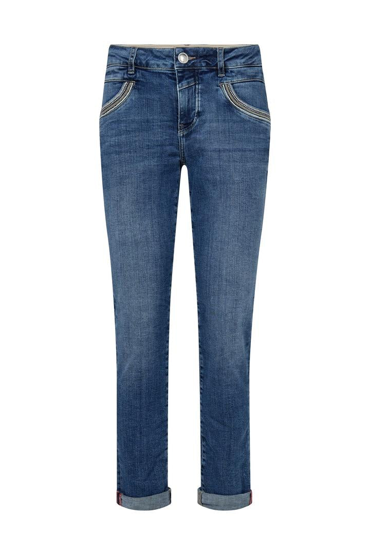Mid Blue slim leg denim jeans on a white background. 