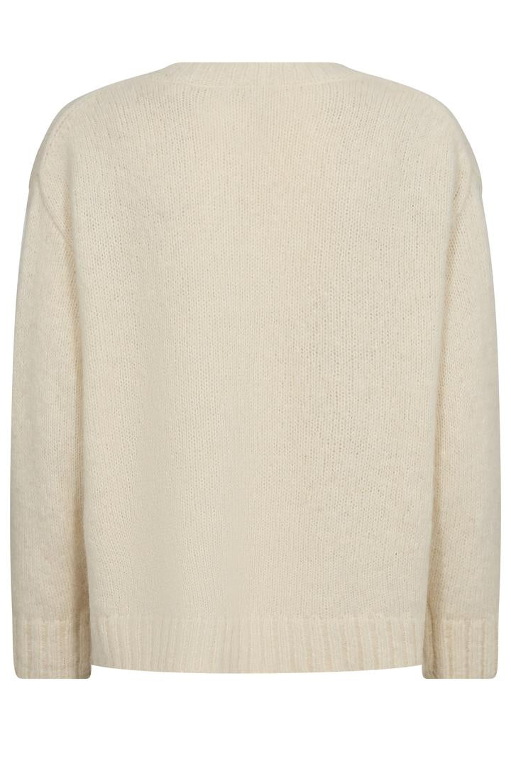 Ecru v neck sweater with rib detail hem , cuff and neck.  Back. 