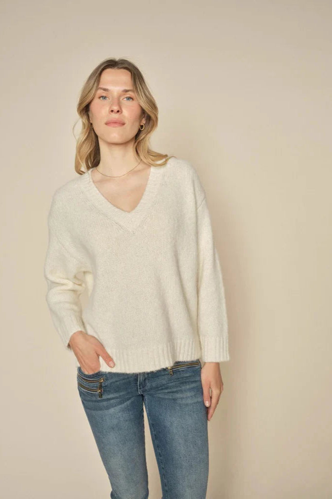 v neck sweater in ecru with ribbed hem and cuff.