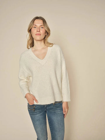 v neck sweater in ecru with ribbed hem and cuff.