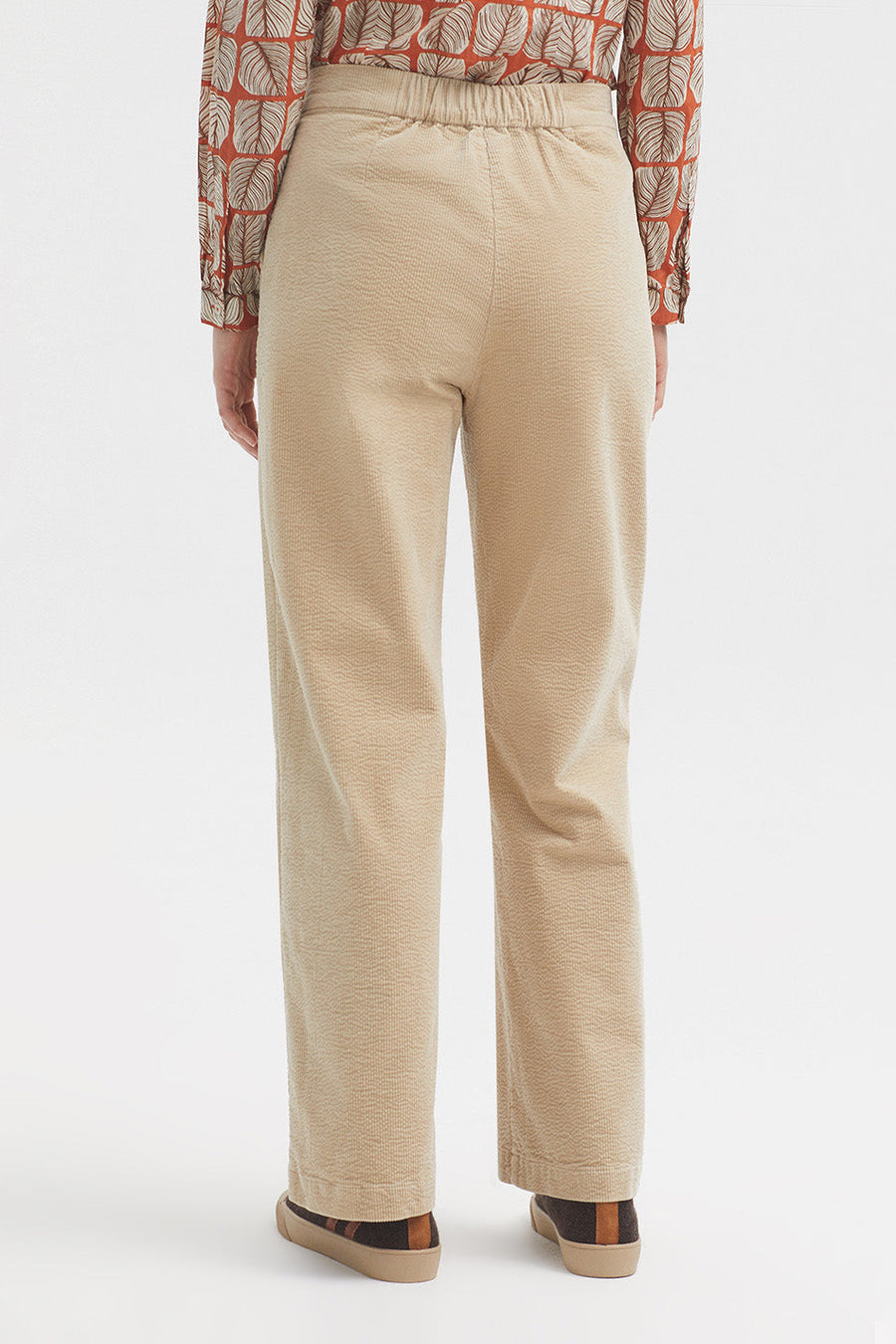 Straight leg bubble cord trouser in dark ecru with tan button. 