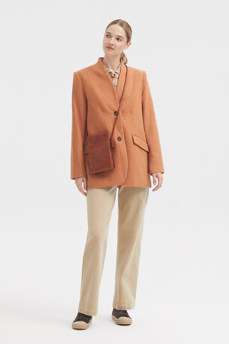 Straight leg bubble cord trouser in dark ecru with tan button. 