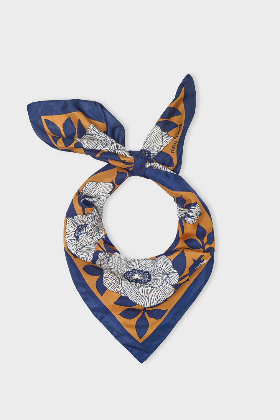 Floral pattern silk scarf with white flowers on a brown background