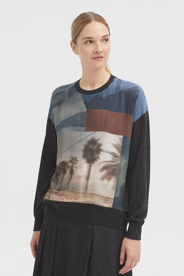 Grey Base wool blend top with round neck and front graphic. 