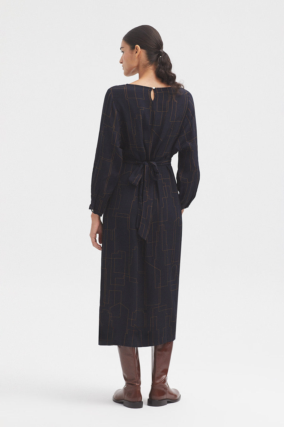 Long Sleeve Navy dress with all over print and waist tie. 