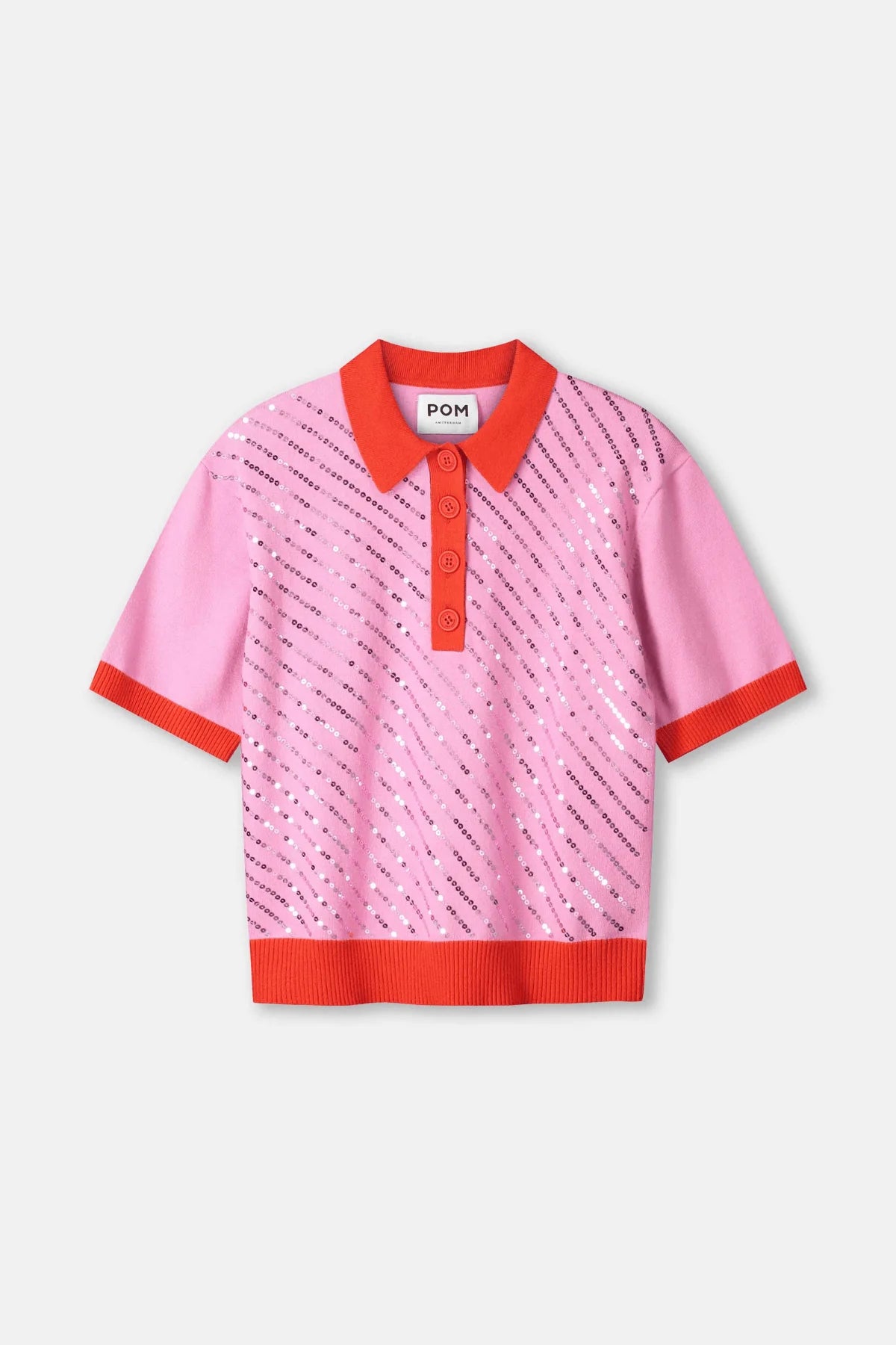 A pink short-sleeve knit polo shirt with orange-red trim on the collar, placket, cuffs, and hem. The body of the shirt features a pattern of diagonal black text reading 'POM'.