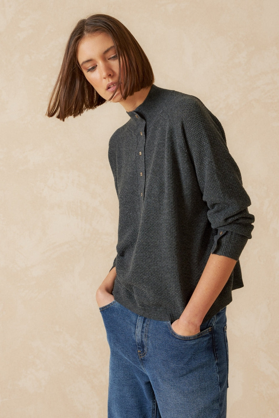 Grey knit long sleeve jumper with Perkins collar and raglan sleeve. 