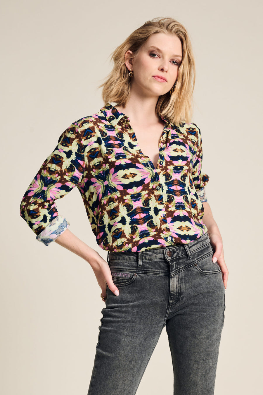 Colourful butterfly floral print blouse with long sleeves and button front. 