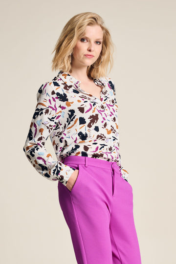Floral Print blouse with white base, long sleeve and collar. Floral print in fushia, black and tan colours. 