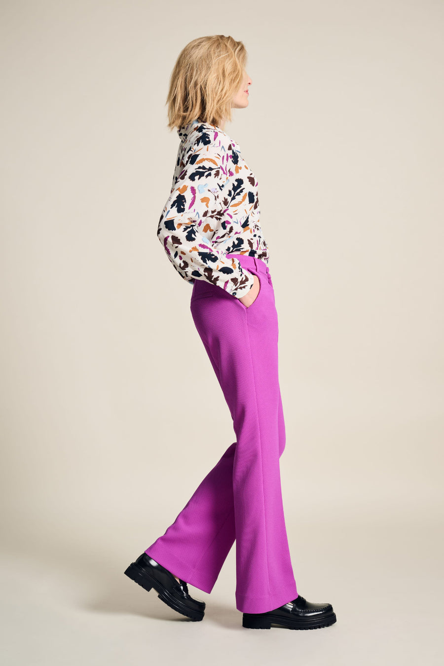 Floral Print blouse with white base, long sleeve and collar. Floral print in fushia, black and tan colours. 