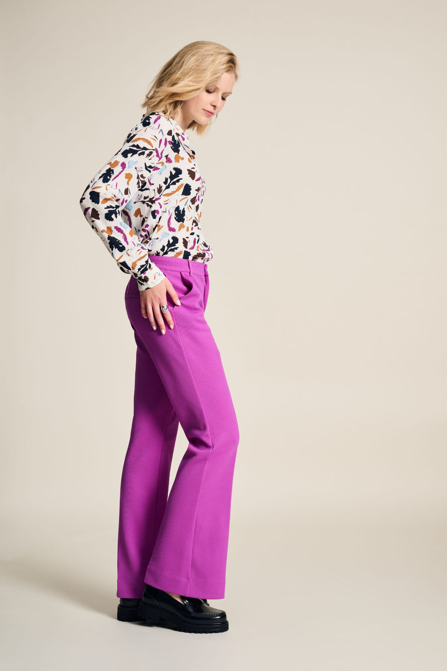 Floral Print blouse with white base, long sleeve and collar. Floral print in fushia, black and tan colours. 