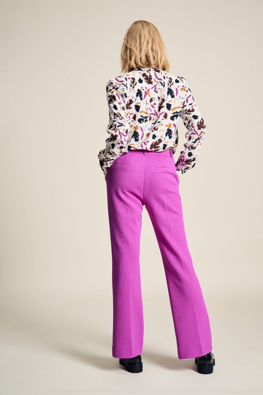 Floral Print blouse with white base, long sleeve and collar. Floral print in fushia, black and tan colours. 
