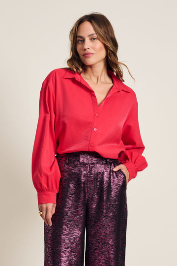Vibrant Pink long sleeve shirt with slight shimmer in the fabric. 