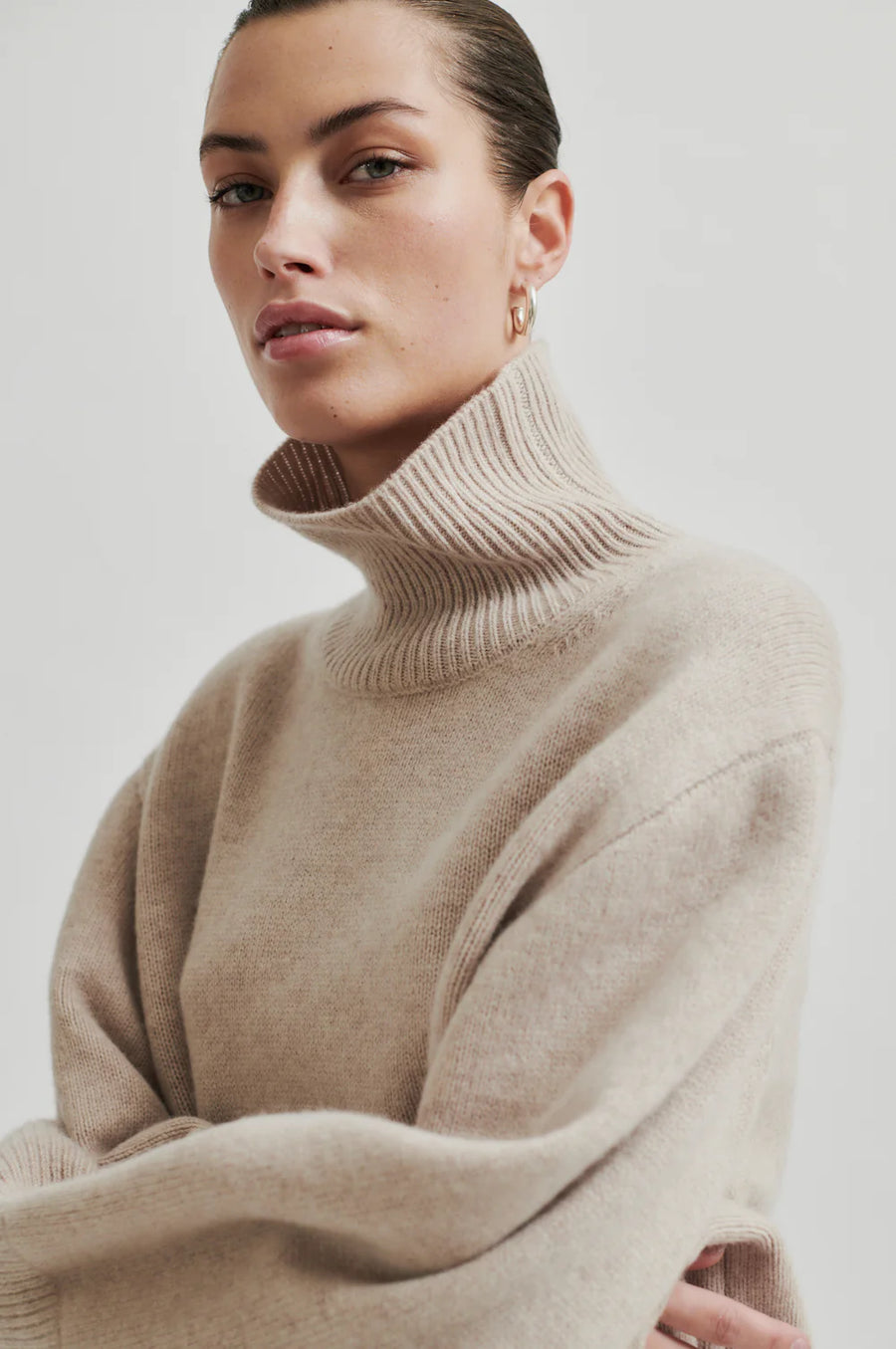 Turtle neck long sleeve sweater in cream. Wide fit.