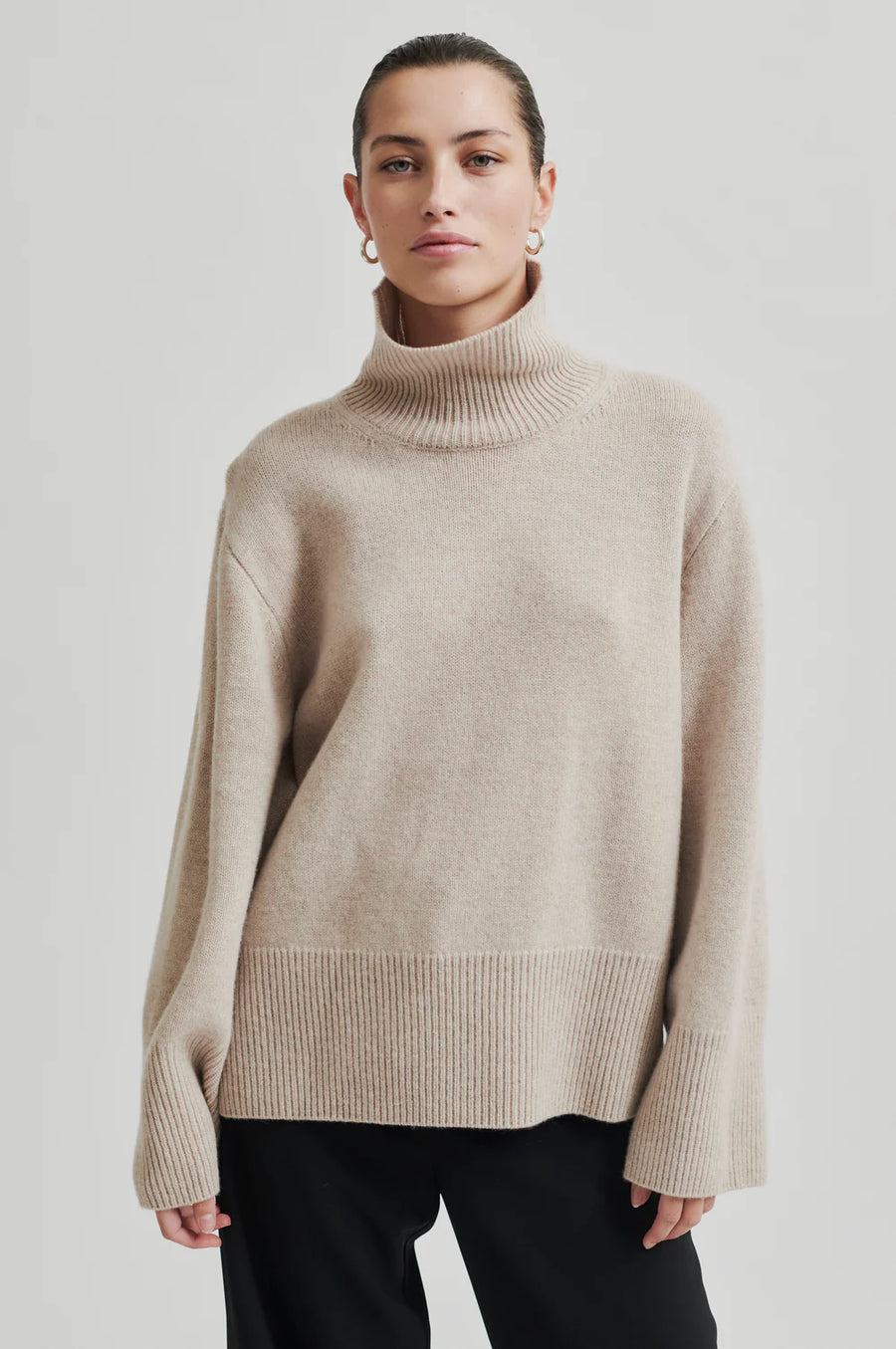 Turtle neck long sleeve sweater in cream. Wide fit.