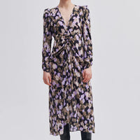 Patterned maxi dress, abstract print on black base. V neck, concealed zip, elasticated section at  front and draped effect. 