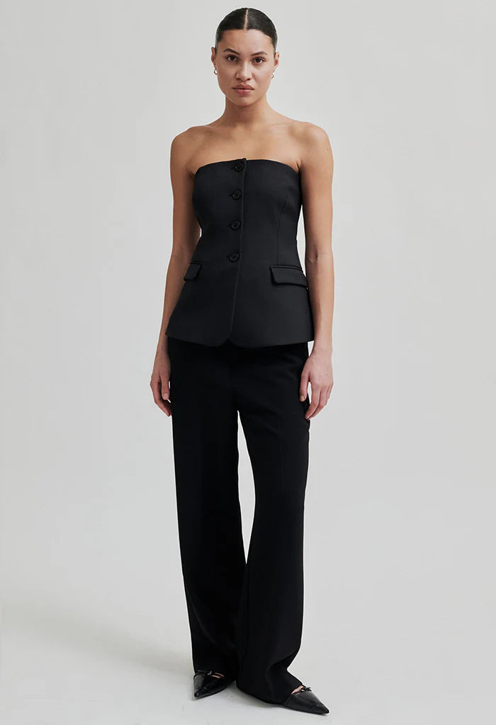 Mid waist wide leg pants in black with plated front. 