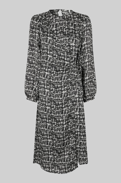Monochrome long sleeve dress with crossover front that ties to one side.