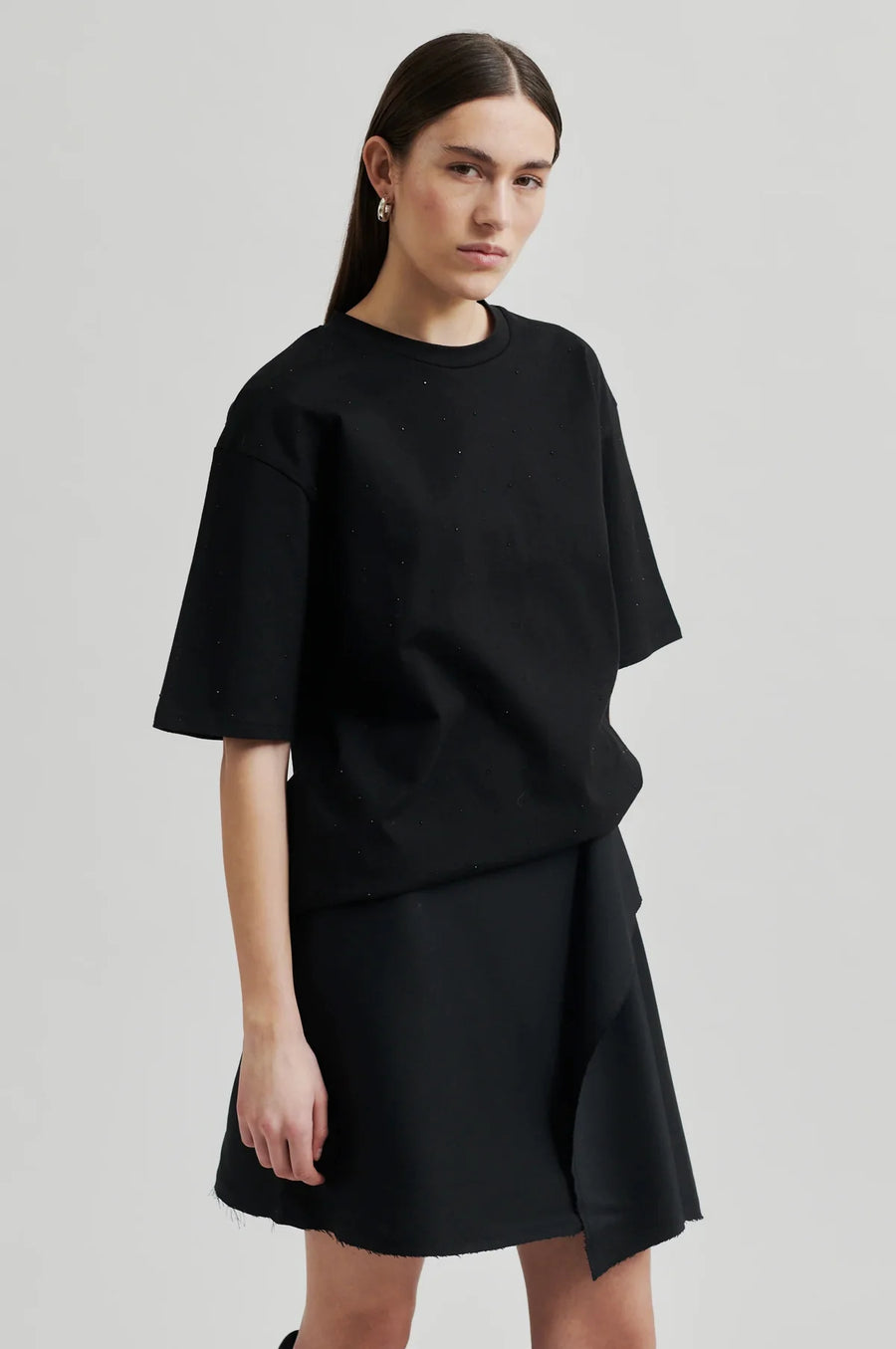 Round Neck Tee with elbow length sleeve and glitter detail throughout. 