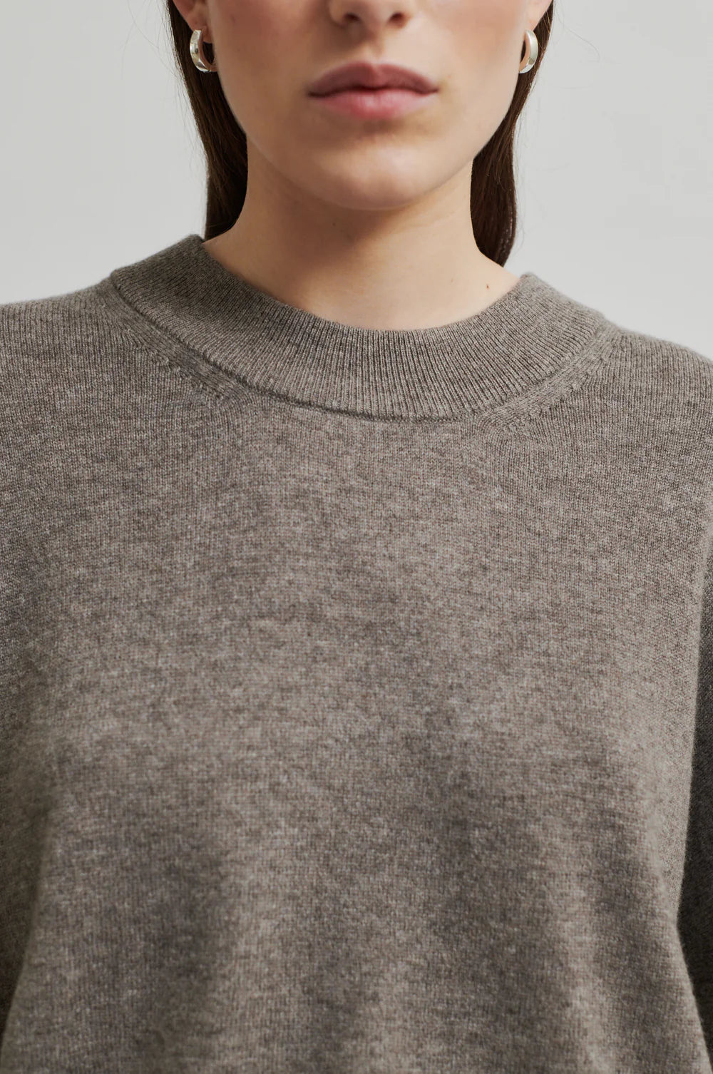 Round Neck Soft Cashmere Wool Blend Knit. Ribbed hem, cuff and neckline in a walnut colour. 