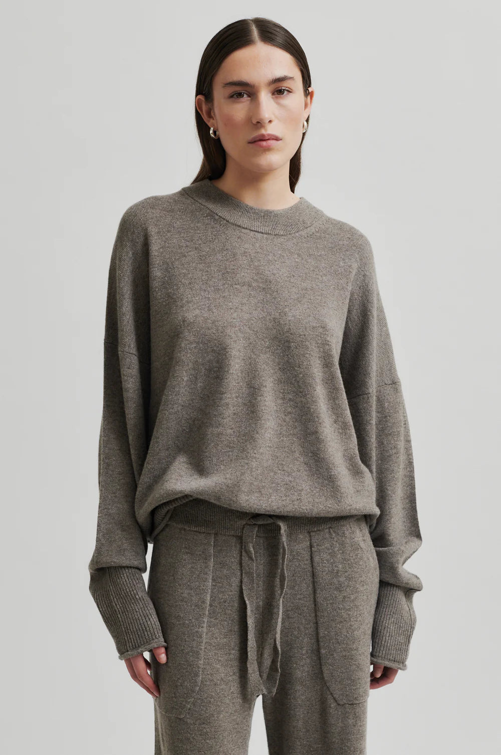 Round Neck Soft Cashmere Wool Blend Knit. Ribbed hem, cuff and neckline in a walnut colour. 