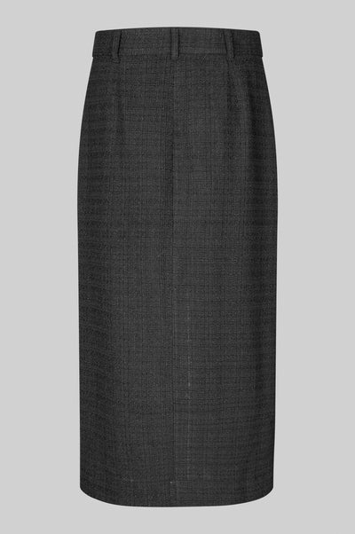 Back of long tailored black skirt with front slit. 