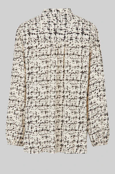 Long sleeve shirt with all over print in a cream base with black print. 