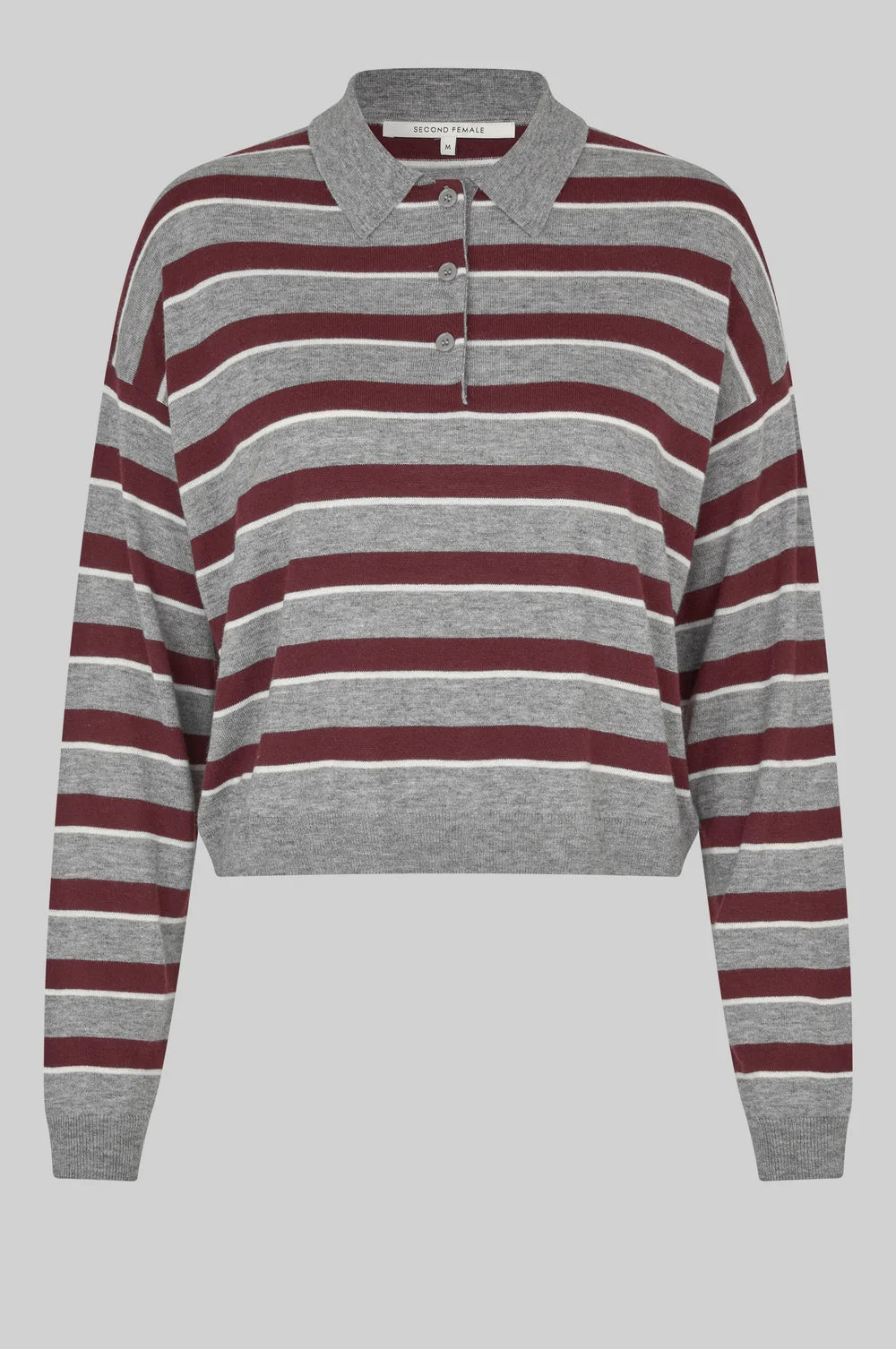 A cropped long-sleeve polo sweater with horizontal stripes in heather grey, burgundy, and thin cream stripes, shown against a solid grey background.