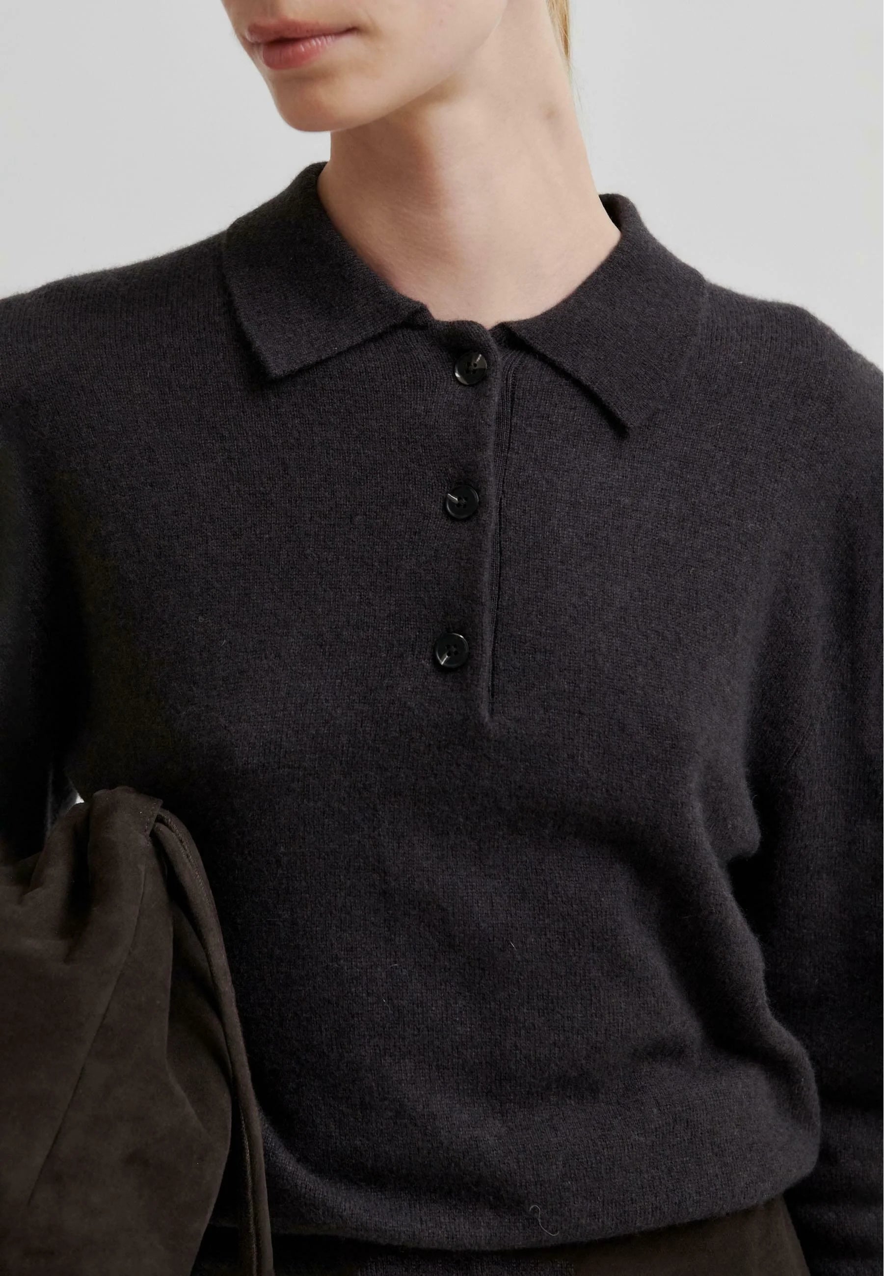 Chocolate Brown polo knit sweater worn by a woman on a light gray background