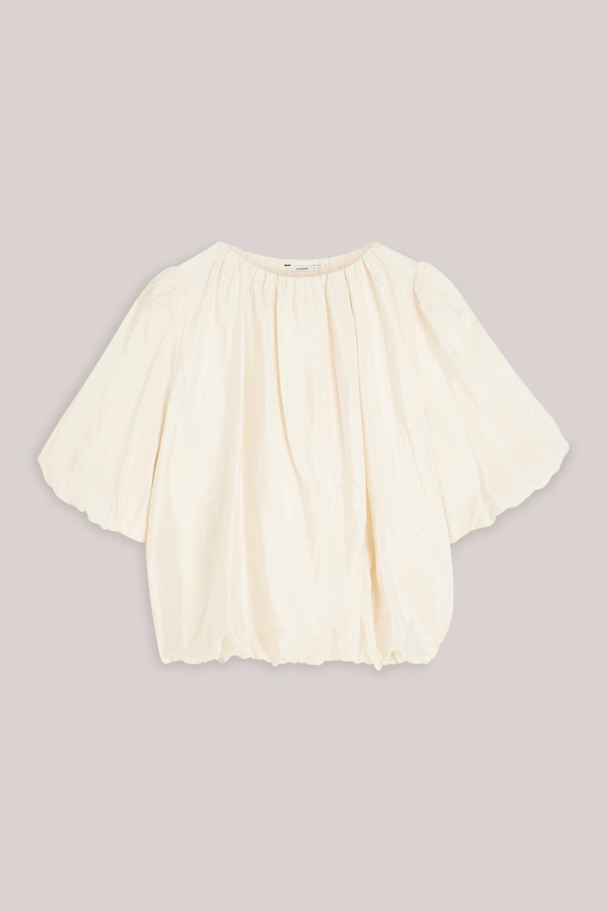 White blouse with short ballon sleeves on a light background
