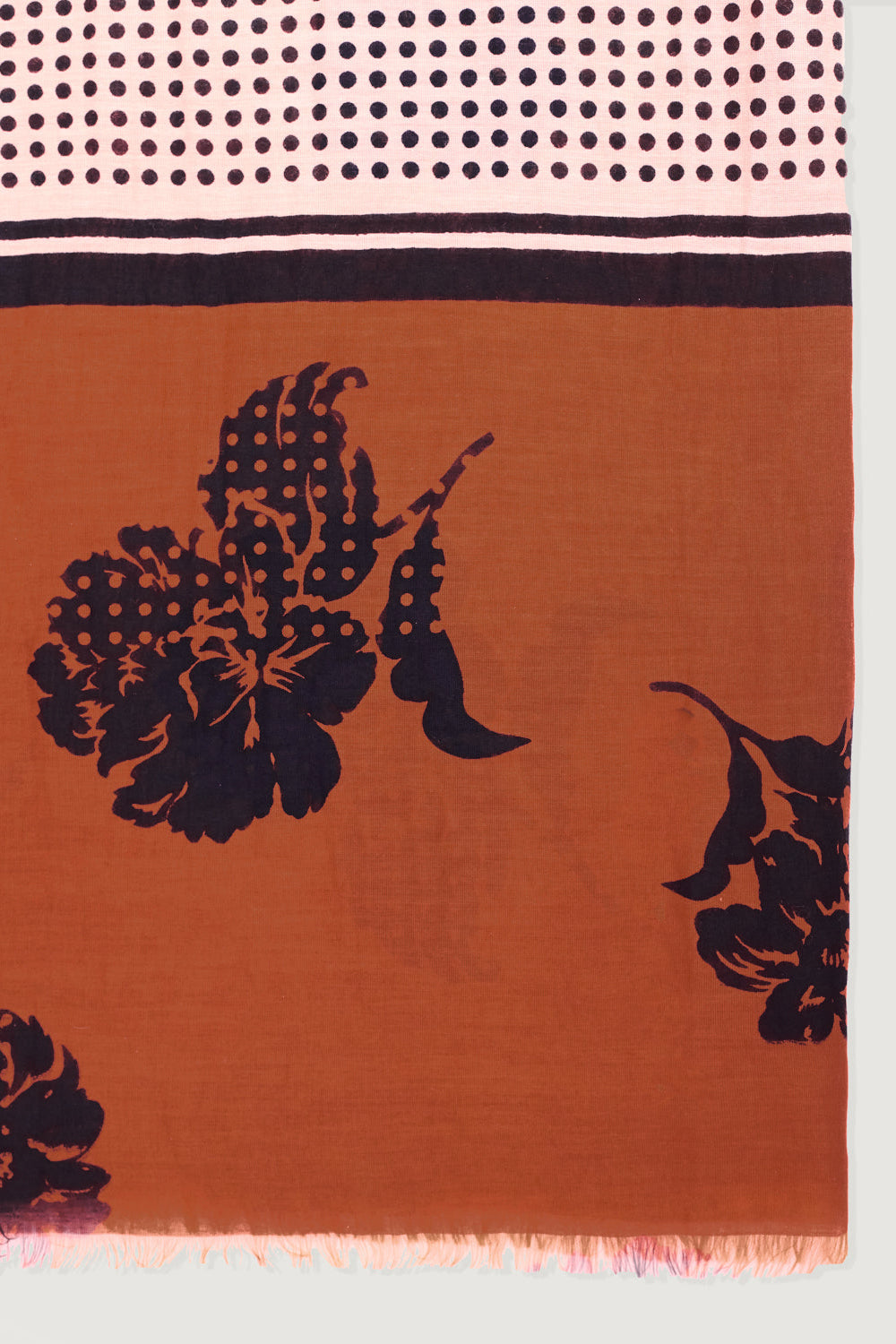 Scarf with black floral patterns on an orange background