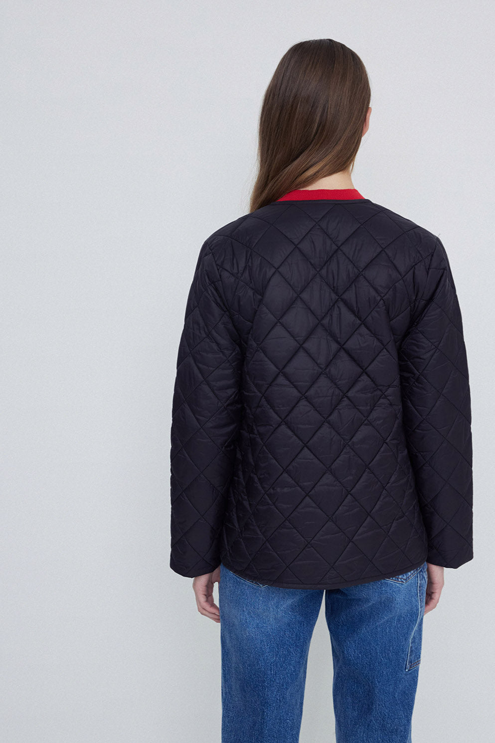 Back image of Black Long Sleeve Quilted Jacket with front zip. 