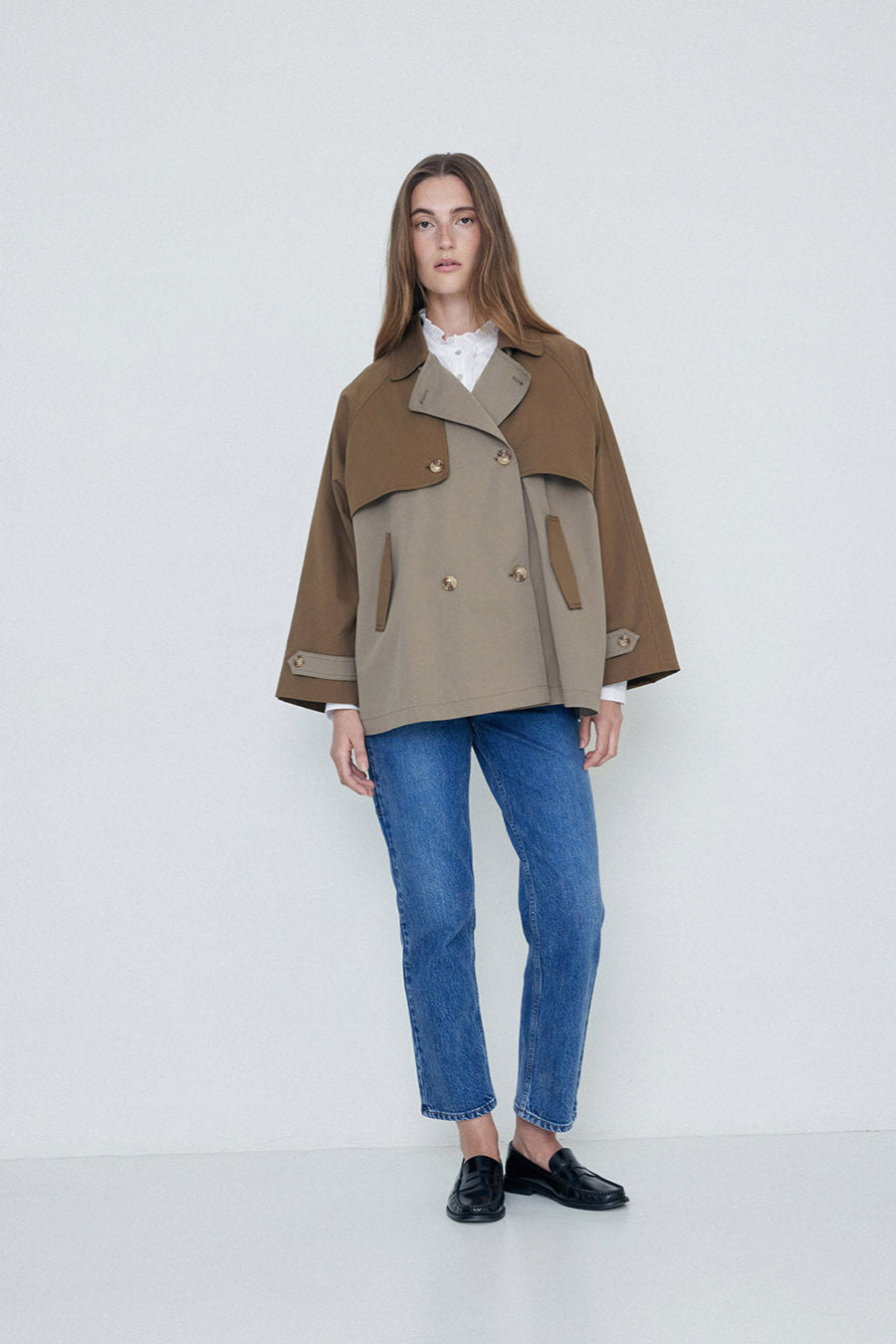 Khaki two tone double breasted short length trench coat.