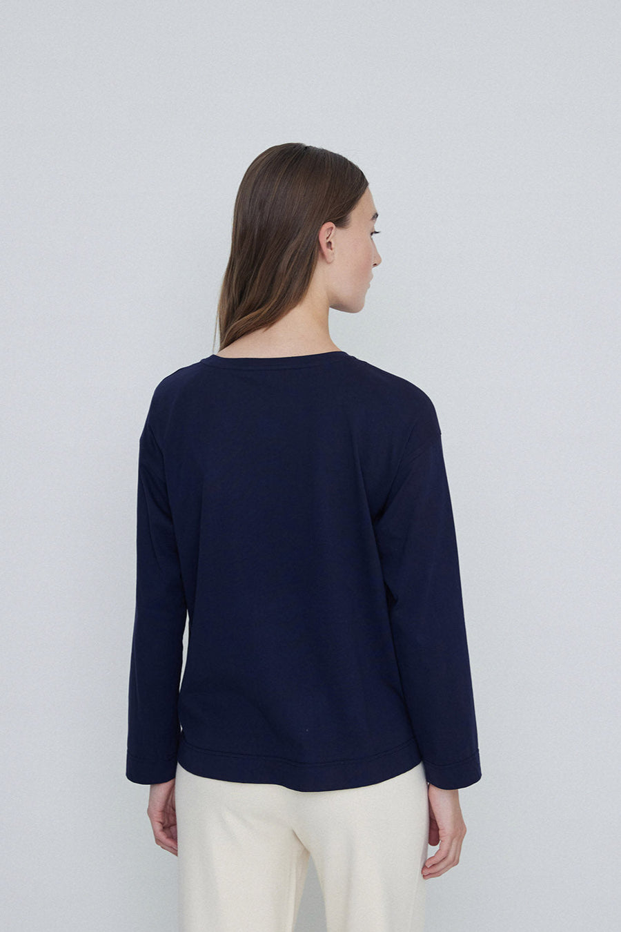 Navy round neck long sleeve tee shirt back.