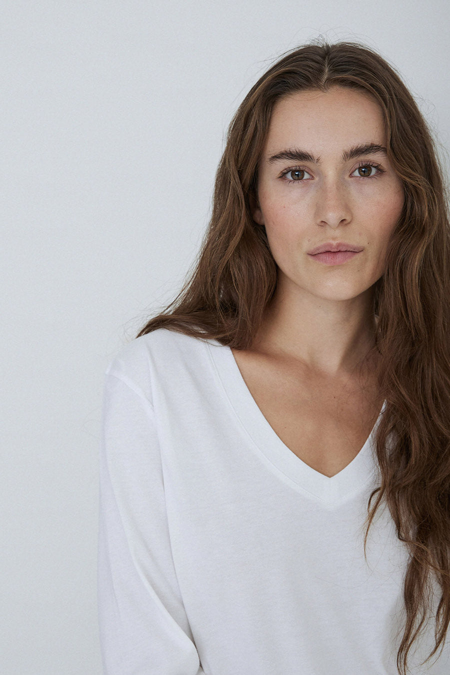 White organic cotton v neck tee with long sleeves. 