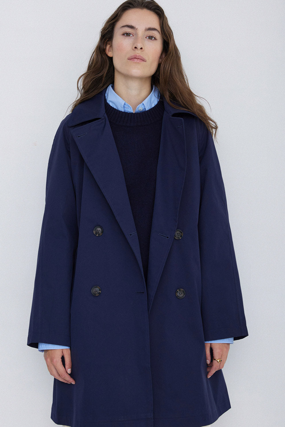 Navy midi length double breasted trench coat with wide belt. 