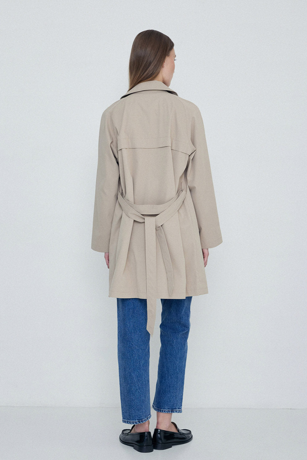 Sand midi length double breasted trench with wide belt. 